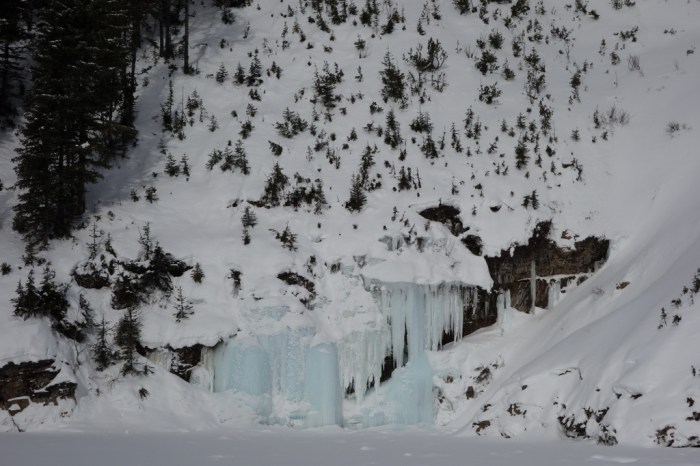 Frozen ice at the bottom of a massive old avalanche chute