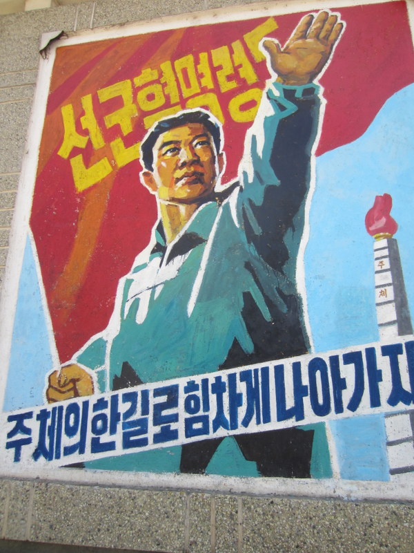 Revolutionary posters decorate the street much like billboards in other countries