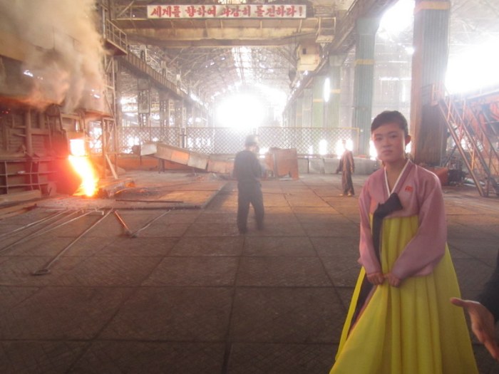Her dress remains perfectly clean. Chollima Steel Works
