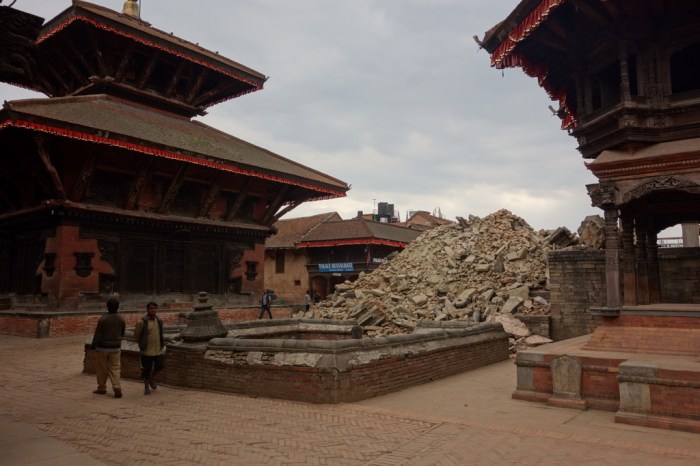 Two pagodas stand strong over a less fortunate monument