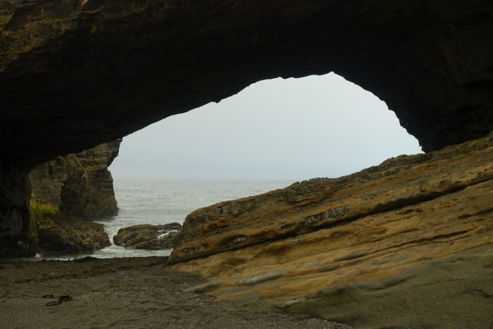 Passing through the cave at Tsusiat Point