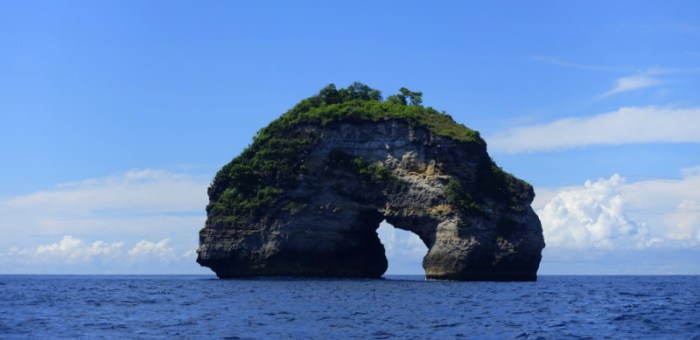 A giant doughnut emerges from the depths of the ocean
