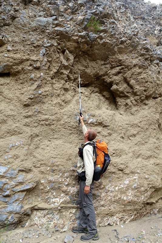 Mud from a huge flash flood remains caked on the canyon cliffs