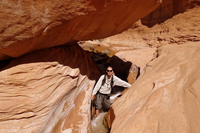Scrambling through a mini slot canyon