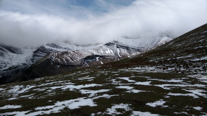 Sun, cloud, and skiffs of snow